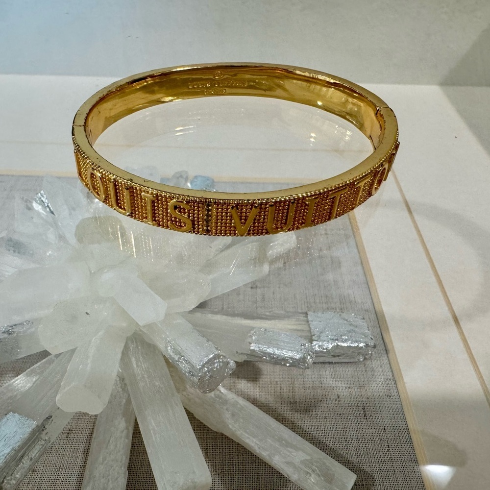 Inspired L V Designer Gold tone bangle. Stainless Steel.